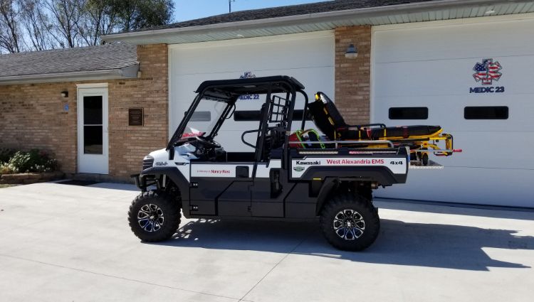 An Ems Utv With A Fully Equipped Skid Unit On It.