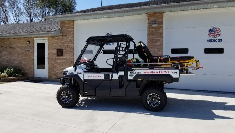 Design Innovations Making EMS ATV Skids Safer For Patients & Providers EMS ATV skid in front of a home