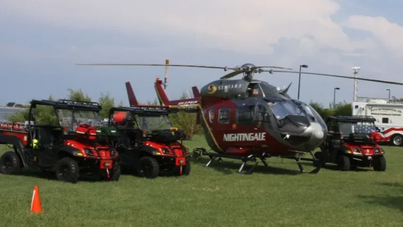 Fire skid unit next to a helicopter at an airfield