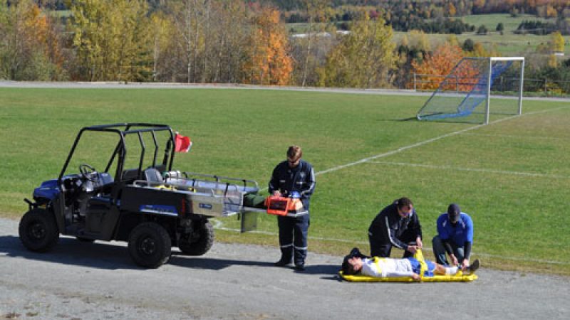 Injured soccer player being transported with a medlite.
