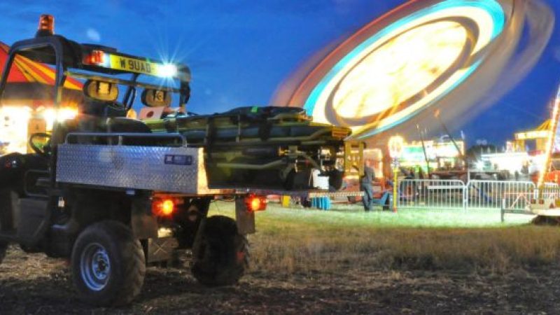 A photo of a rescue skid on a UTV at a carnival event.