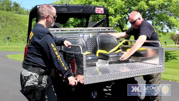 Officer Putting Seat In UTV