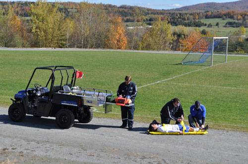 Injured soccer player being transported with a medlite.