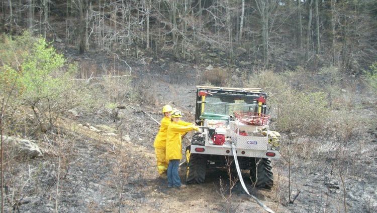 A fire truck atv ready to fight fire in a remote rural location.