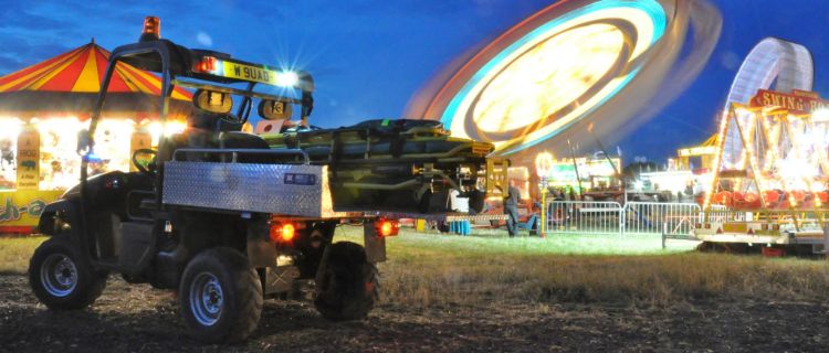 A photo of a rescue skid on a UTV at a carnival event.