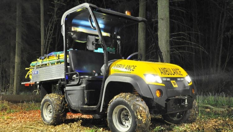 what-utv-ambulance-when-used Yellow UTV ambulance in a wooded area